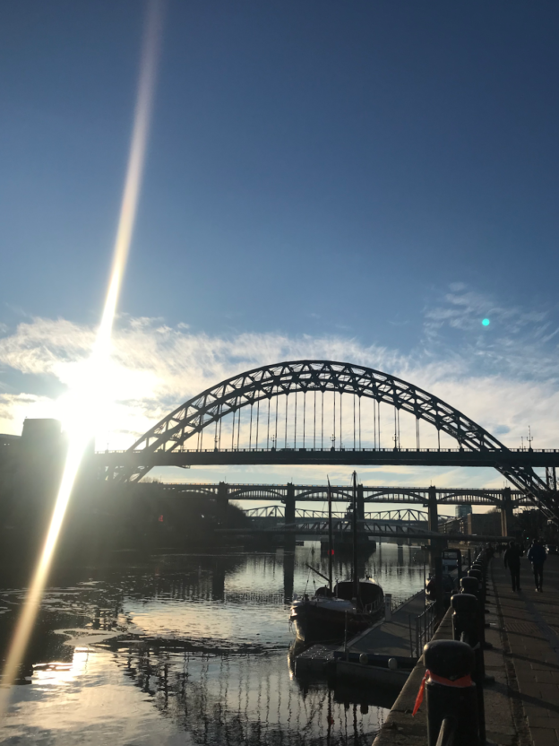 A bright sun glinting above the Tyne bridge in Newcastle
