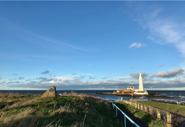 Whitley Bay lighthouse against a blue sky