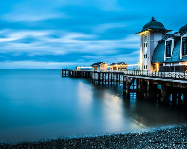 Penarth Pier against inky blue sea and sunset